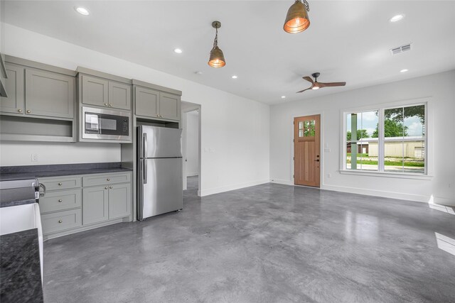 741 Pecan St, New Ulm, TX 78950 - kitchen with appliances with stainless steel finishes, gray cabinetry, concrete flooring, dark countertops, and recessed lighting