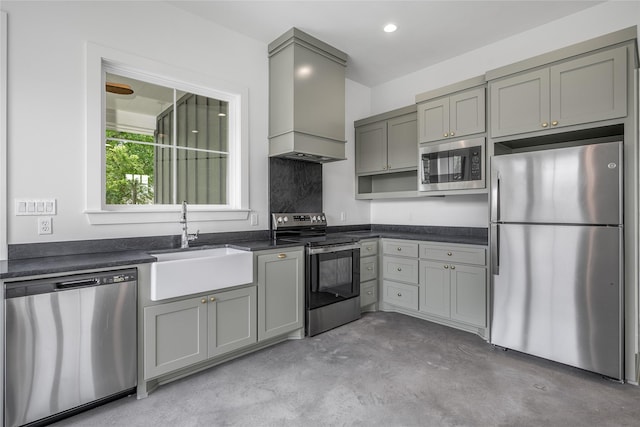 741 Pecan St, New Ulm, TX 78950 - kitchen with stainless steel appliances, gray cabinets, custom range hood, dark countertops, and concrete flooring
