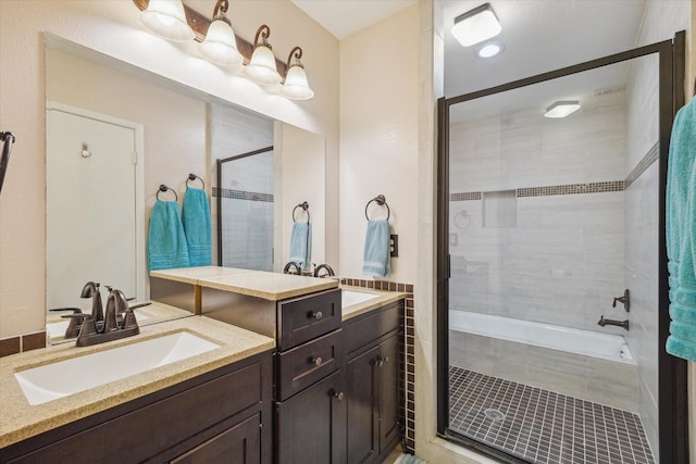 9400 Doliver Dr Unit 30, Houston, TX 77063 - bathroom with two vanities and tiled shower / bath