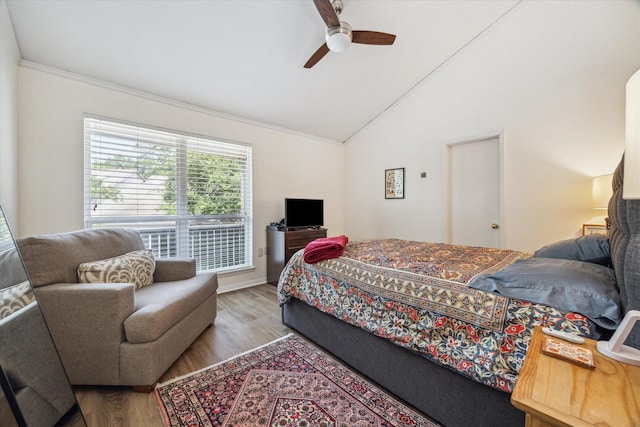 9400 Doliver Dr Unit 30, Houston, TX 77063 - bedroom featuring wood finished floors, vaulted ceiling, ornamental molding, and a ceiling fan