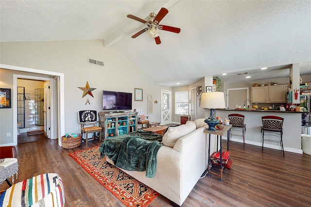 3114 Whetrock Ln, Sugar Land, TX 77479 - living room featuring a ceiling fan, wood finished floors, beamed ceiling, high vaulted ceiling, and a textured ceiling