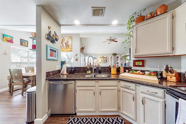 3114 Whetrock Ln, Sugar Land, TX 77479 - kitchen with dishwasher, wood finished floors, electric range oven, a ceiling fan, and recessed lighting