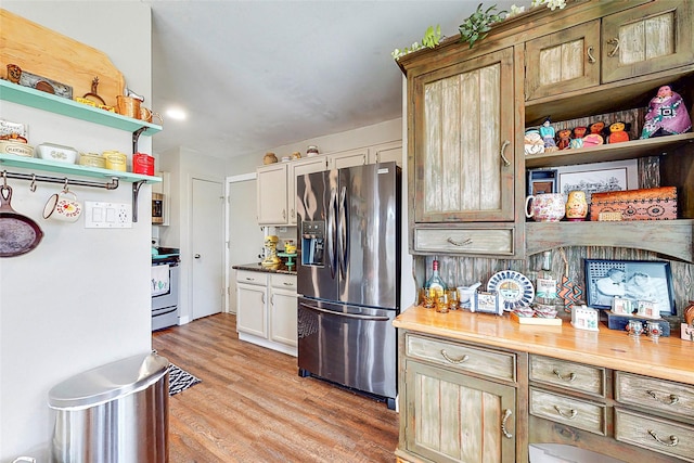 3114 Whetrock Ln, Sugar Land, TX 77479 - kitchen with stainless steel appliances, open shelves, and light wood finished floors
