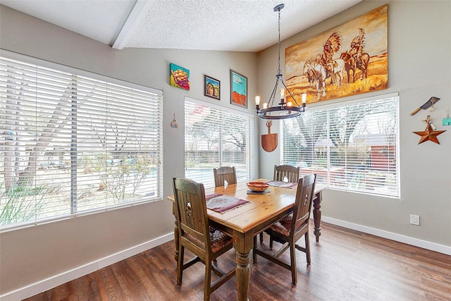 3114 Whetrock Ln, Sugar Land, TX 77479 - dining area with lofted ceiling, a chandelier, wood finished floors, and a textured ceiling