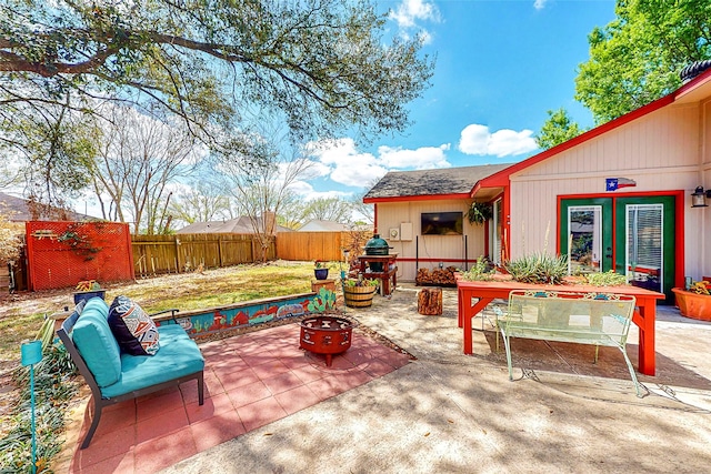 3114 Whetrock Ln, Sugar Land, TX 77479 - fenced backyard with a patio, a fire pit, and area for grilling