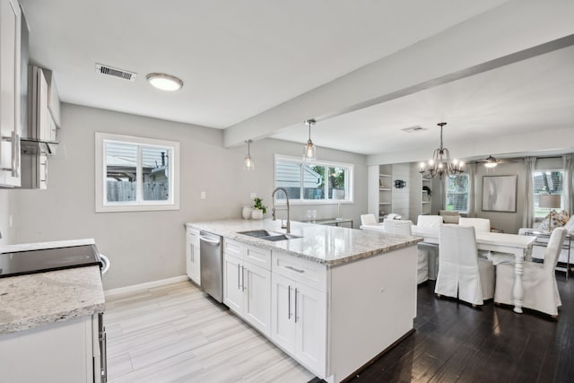 2014 Spillers Ln, Houston, TX 77043 - kitchen featuring white cabinets, a peninsula, stainless steel dishwasher, light wood finished floors, and light stone counters