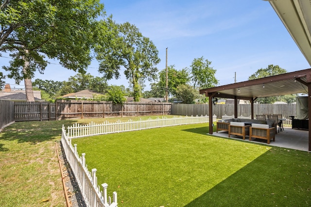 2014 Spillers Ln, Houston, TX 77043 - fenced backyard featuring an outdoor hangout area and a patio