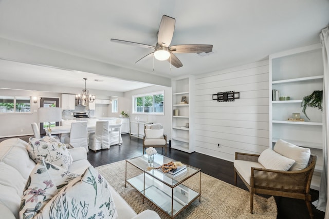 2014 Spillers Ln, Houston, TX 77043 - living area featuring dark wood-style flooring, a chandelier, and ceiling fan