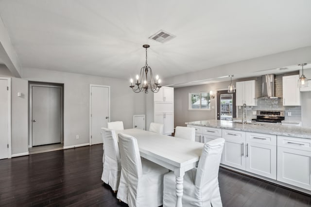 2014 Spillers Ln, Houston, TX 77043 - dining area featuring dark wood-style flooring and a chandelier