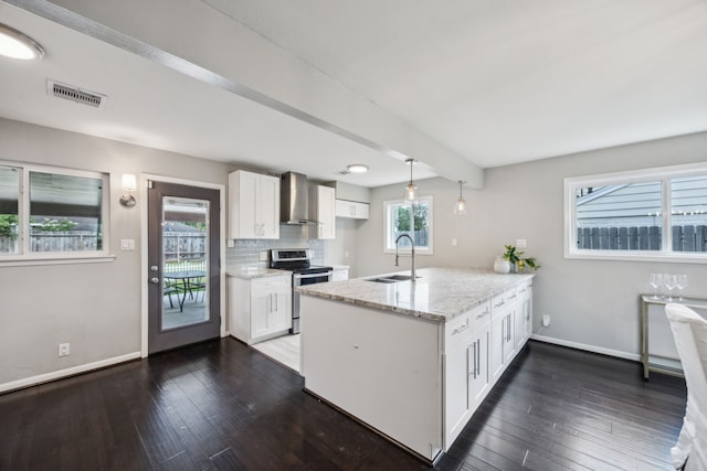 2014 Spillers Ln, Houston, TX 77043 - kitchen featuring stainless steel electric stove, a peninsula, wall chimney exhaust hood, white cabinetry, and dark wood-style flooring