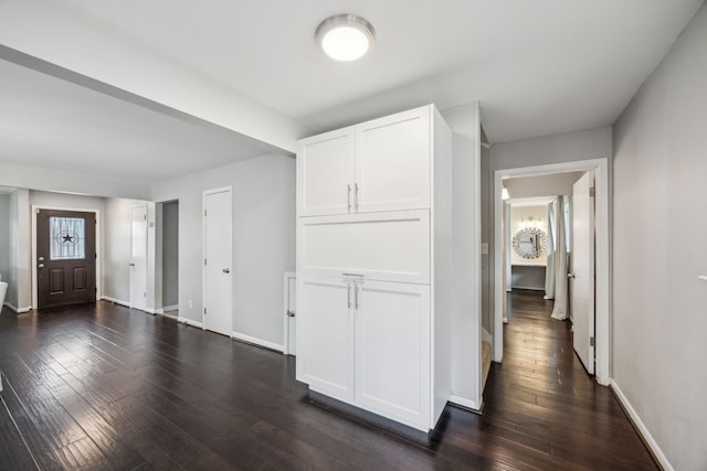 2014 Spillers Ln, Houston, TX 77043 - hallway featuring dark wood finished floors and baseboards
