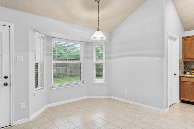 16439 Willingham Way, Houston, TX 77095 - unfurnished dining area with lofted ceiling and light tile patterned floors