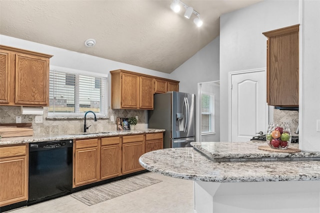 16439 Willingham Way, Houston, TX 77095 - kitchen featuring stainless steel fridge with ice dispenser, dishwasher, lofted ceiling, decorative backsplash, and light stone counters