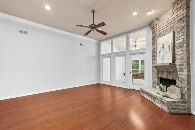 16439 Willingham Way, Houston, TX 77095 - unfurnished living room with ceiling fan, a fireplace, wood finished floors, crown molding, and recessed lighting