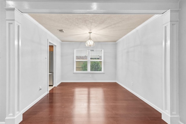 16439 Willingham Way, Houston, TX 77095 - unfurnished dining area featuring crown molding, a chandelier, dark wood-style floors, and a textured ceiling
