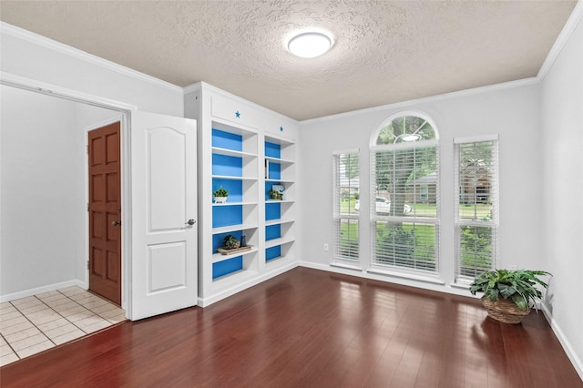 16439 Willingham Way, Houston, TX 77095 - spare room featuring wood finished floors, a textured ceiling, and crown molding