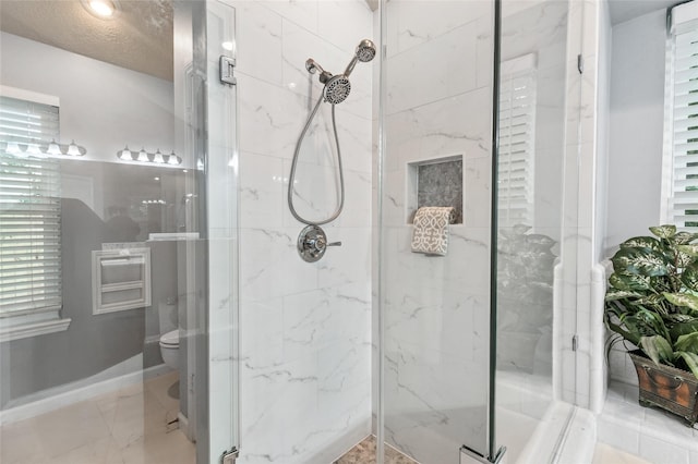 16439 Willingham Way, Houston, TX 77095 - bathroom with a marble finish shower and marble finish floors