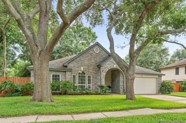 16439 Willingham Way, Houston, TX 77095 - view of front of property with brick siding, an attached garage, driveway, and roof with shingles