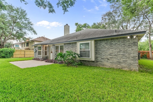 16439 Willingham Way, Houston, TX 77095 - back of house with a patio area, a chimney, and brick siding