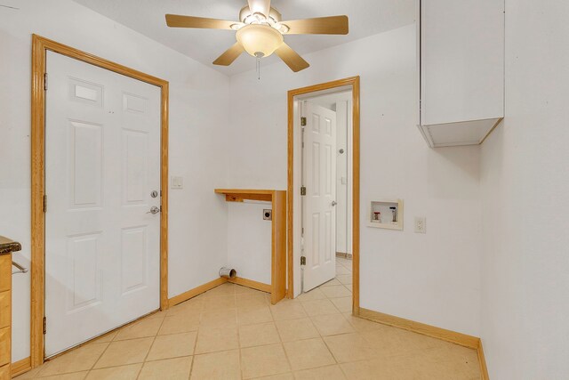 123 Sea Gull Dr, Livingston, TX 77351 - laundry area featuring electric dryer hookup, hookup for a washing machine, ceiling fan, cabinet space, and light tile patterned floors