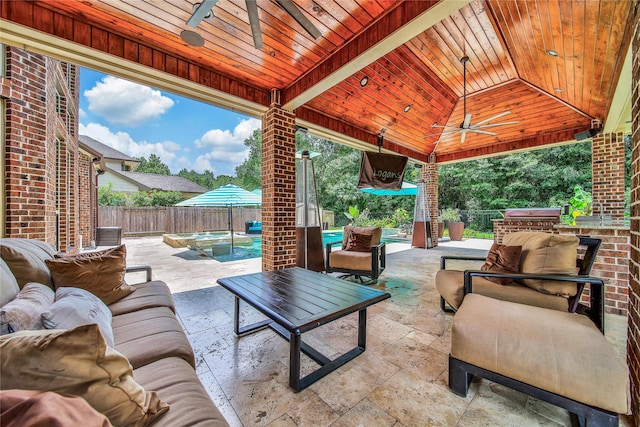 145 Bronze Bow Dr, Montgomery, TX 77316 - fenced backyard featuring ceiling fan, outdoor lounge area, a patio, and a gazebo