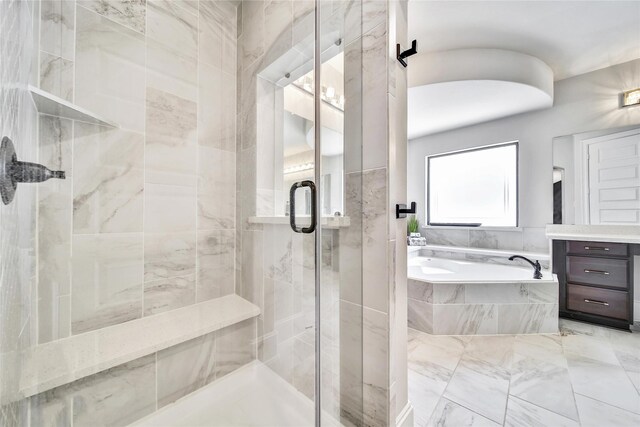 145 Bronze Bow Dr, Montgomery, TX 77316 - full bath with a bath, a shower stall, vanity, and marble finish flooring
