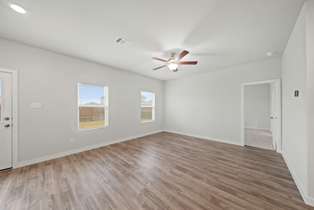 25017 Pomegranate Pl, Montgomery, TX 77316 - empty room with ceiling fan, wood finished floors, and a smoke detector