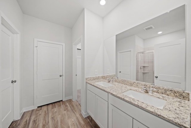 25017 Pomegranate Pl, Montgomery, TX 77316 - full bath featuring a stall shower, double vanity, wood finished floors, and recessed lighting
