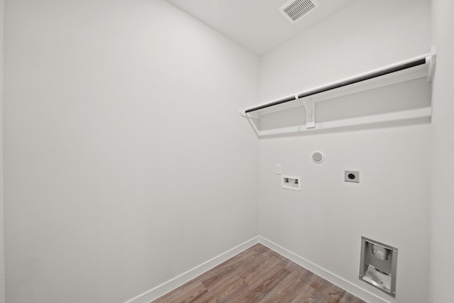 25017 Pomegranate Pl, Montgomery, TX 77316 - washroom featuring electric dryer hookup, washer hookup, wood finished floors, and gas dryer hookup