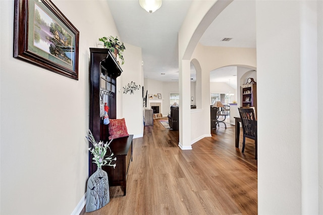 6318 Crystal Forest Trl, Katy, TX 77493 - foyer entrance with light wood-style floors and arched walkways