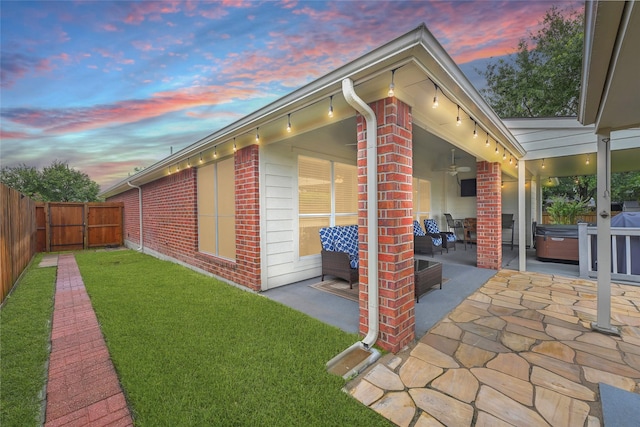 6318 Crystal Forest Trl, Katy, TX 77493 - fenced backyard with a ceiling fan, a patio, and a hot tub