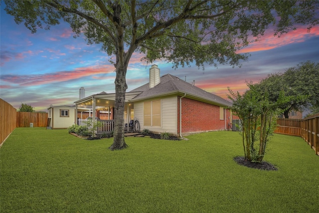 6318 Crystal Forest Trl, Katy, TX 77493 - rear view of house featuring a shed, a fenced backyard, a chimney, and brick siding