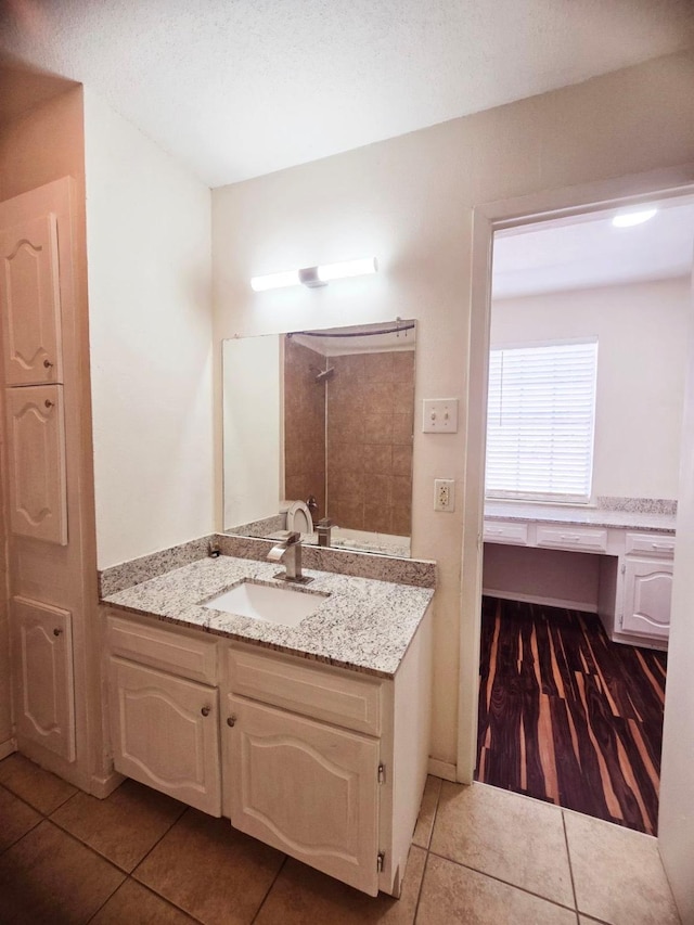 7837 Leonora St, Houston, TX 77061 - bathroom featuring tile patterned flooring, vanity, and a shower