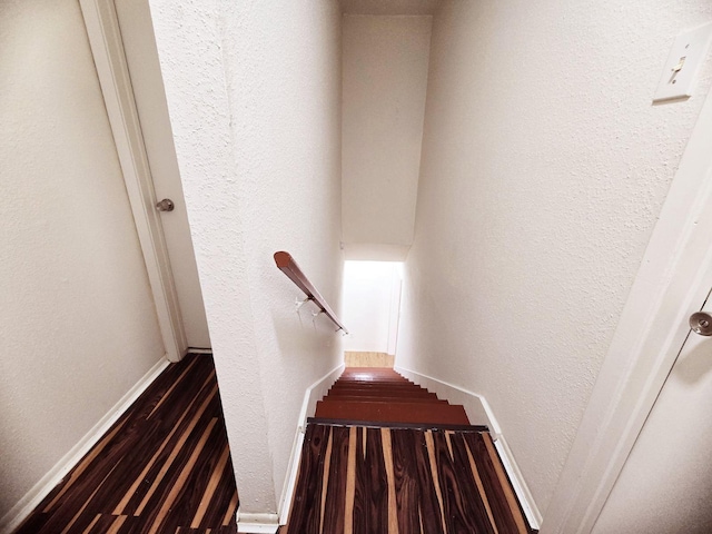 7837 Leonora St, Houston, TX 77061 - staircase featuring wood finished floors and a textured wall
