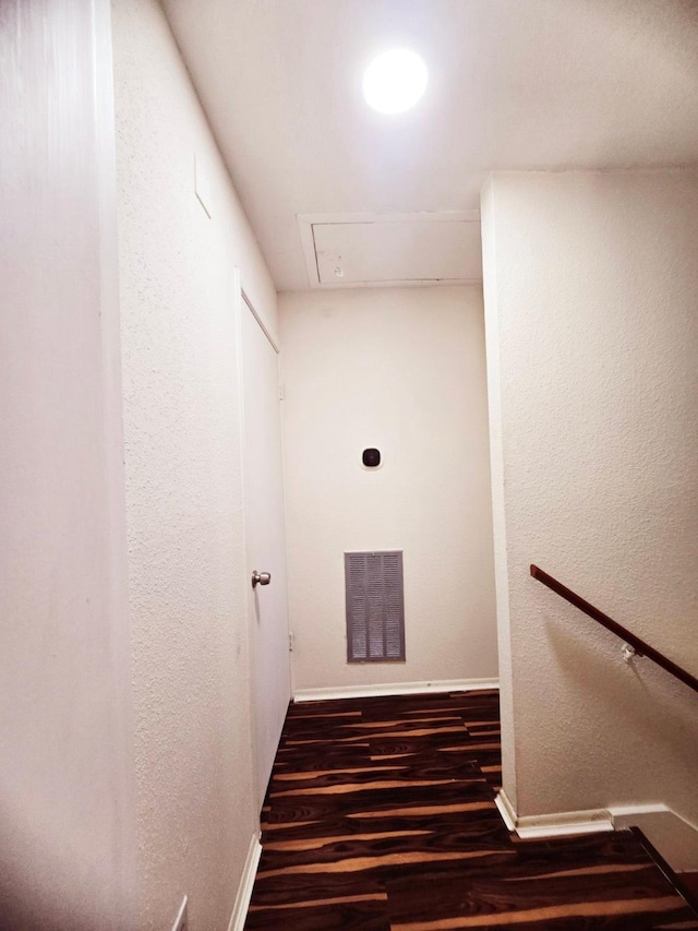 7837 Leonora St, Houston, TX 77061 - hallway featuring wood finished floors, attic access, and a textured wall