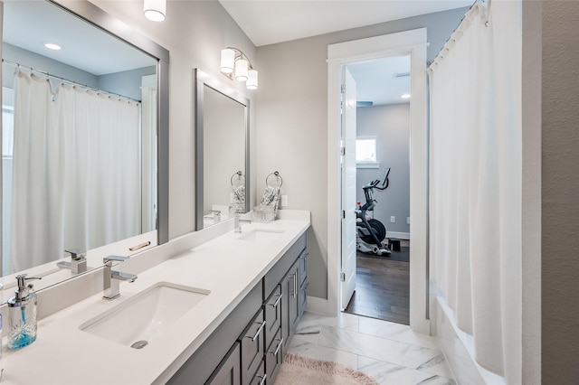 434 Yale Oaks Ln, Houston, TX 77091 - bathroom featuring double vanity and marble look tile flooring