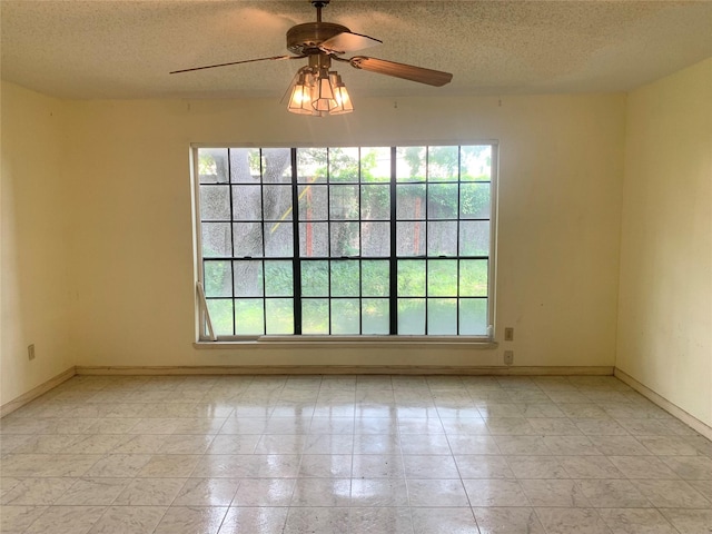 3027 Country Club Blvd, Sugar Land, TX 77478 - unfurnished room featuring healthy amount of natural light, a textured ceiling, and a ceiling fan