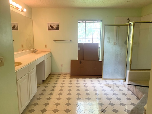 3027 Country Club Blvd, Sugar Land, TX 77478 - full bathroom featuring double vanity, a shower stall, and tile patterned floors