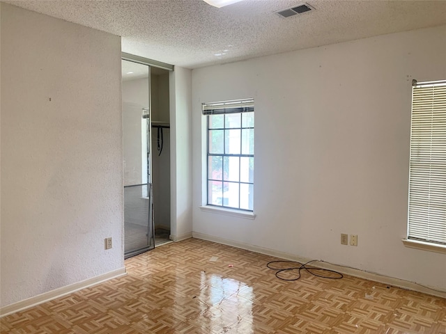 3027 Country Club Blvd, Sugar Land, TX 77478 - spare room featuring a textured ceiling and baseboards