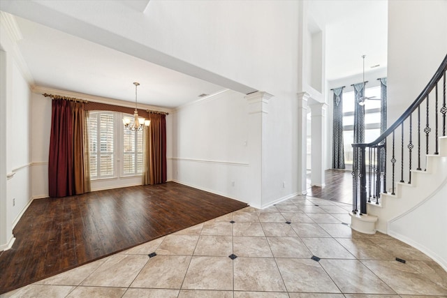 26314 Planters Heath, Katy, TX 77494 - tiled entryway with a chandelier, healthy amount of natural light, stairway, crown molding, and a high ceiling