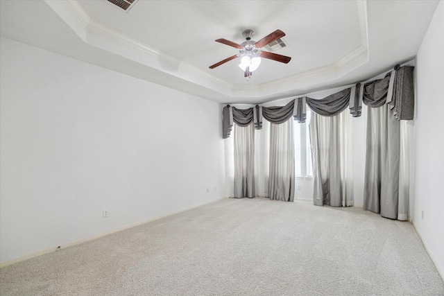 26314 Planters Heath, Katy, TX 77494 - unfurnished room with a tray ceiling, ornamental molding, a ceiling fan, and light colored carpet