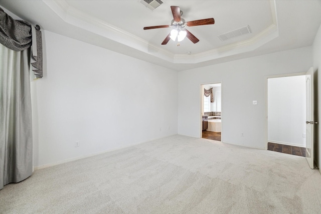 26314 Planters Heath, Katy, TX 77494 - unfurnished bedroom with a tray ceiling, carpet, crown molding, ensuite bath, and a ceiling fan