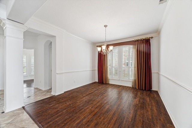 26314 Planters Heath, Katy, TX 77494 - spare room featuring a chandelier, ornamental molding, arched walkways, and wood finished floors