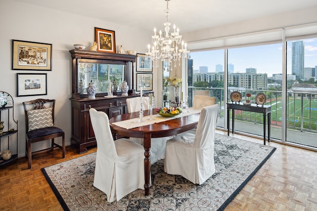 2200 Willowick Rd Unit 7B, Houston, TX 77027 - dining area featuring a view of skyline and a chandelier