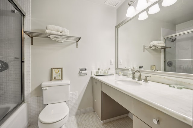 2200 Willowick Rd Unit 7B, Houston, TX 77027 - bathroom featuring vanity, tile patterned floors, and combined bath / shower with glass door
