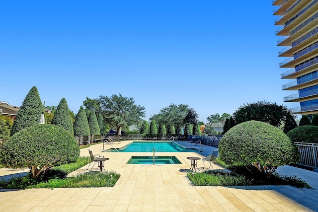 2200 Willowick Rd Unit 7B, Houston, TX 77027 - community pool featuring a hot tub and a patio area