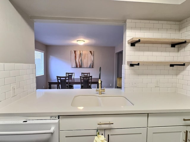 8101 Amelia Rd Unit 407D, Houston, TX 77055 - kitchen featuring dishwasher, tasteful backsplash, light countertops, open shelves, and white cabinets