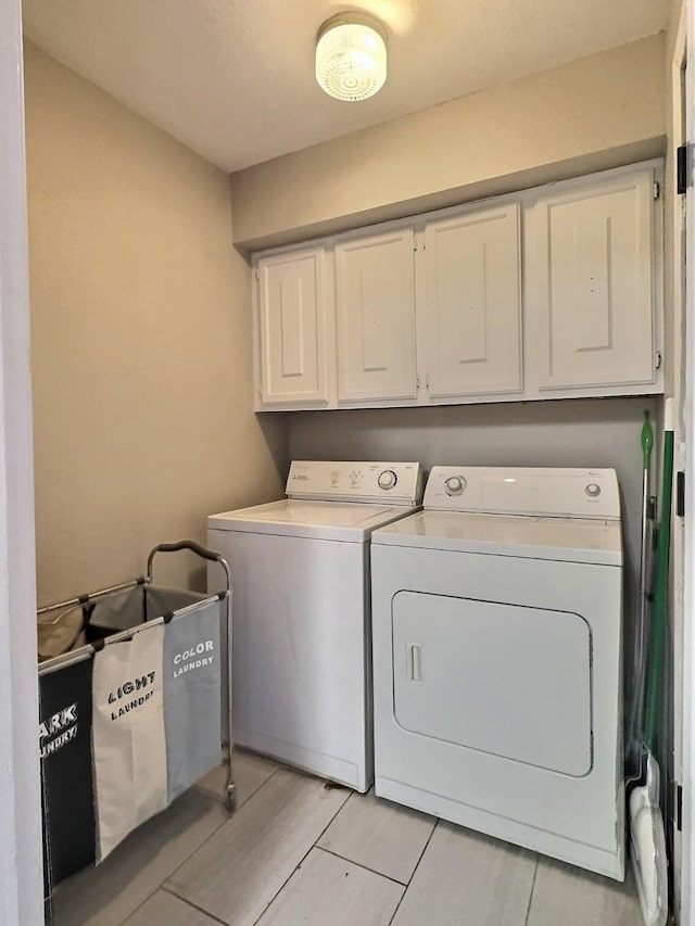 8101 Amelia Rd Unit 407D, Houston, TX 77055 - washroom featuring cabinet space and independent washer and dryer