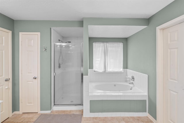 21519 San Marino Dr, Katy, TX 77450 - bathroom with a stall shower, a garden tub, and tile patterned floors
