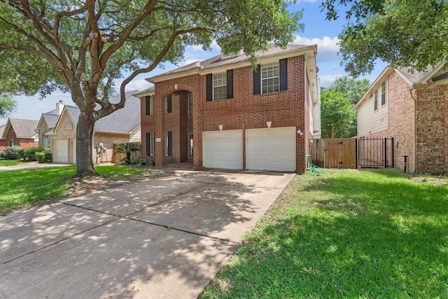 21519 San Marino Dr, Katy, TX 77450 - traditional-style house with brick siding, a gate, driveway, and an attached garage